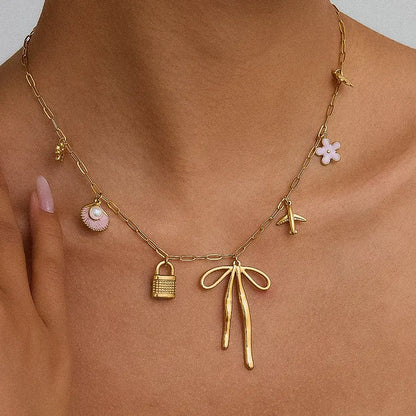 Tyla - bow charm necklace