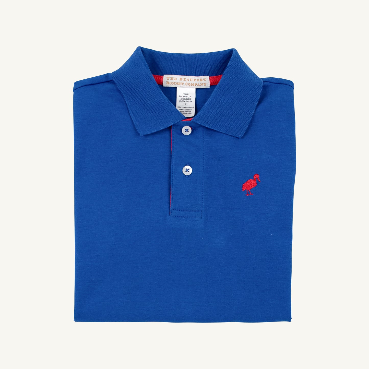 Prim and proper s/s polo onesie - rockefeller royal
